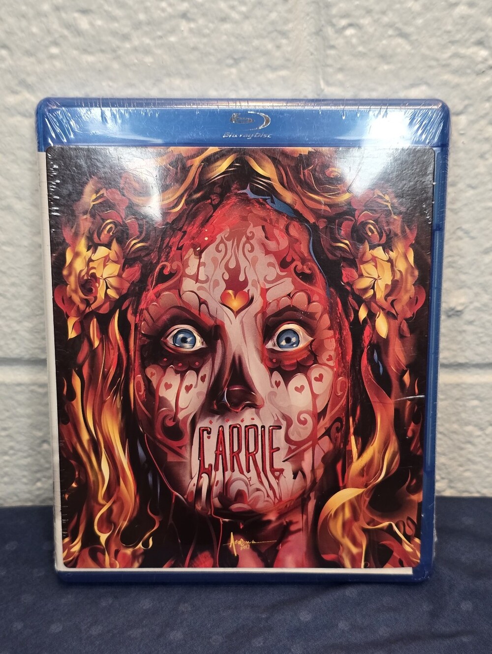 Carrie Blu-ray Steelbook with Vivid Red and Orange Artwork